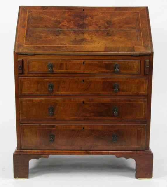 Appraisal: An th Century style walnut bureau the fall flap enclosing