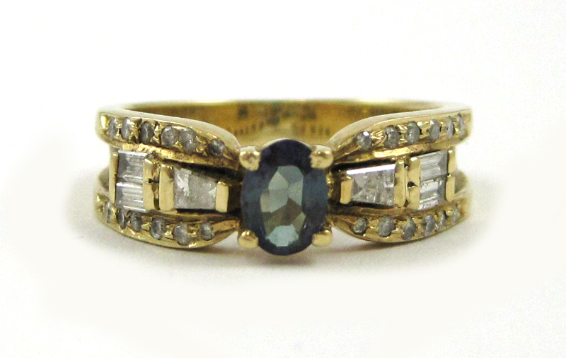 Appraisal: DIAMOND AND FOURTEEN KARAT GOLD RING with round-cut diamonds and