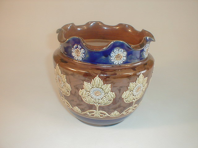 Appraisal: A Royal Doulton stoneware jardiniere with a frill rim over