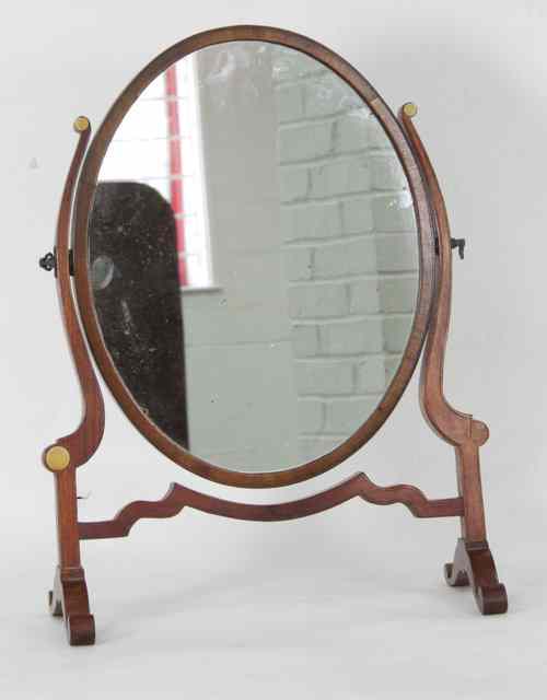 Appraisal: An oval swing frame toilet mirror on splay feet cm