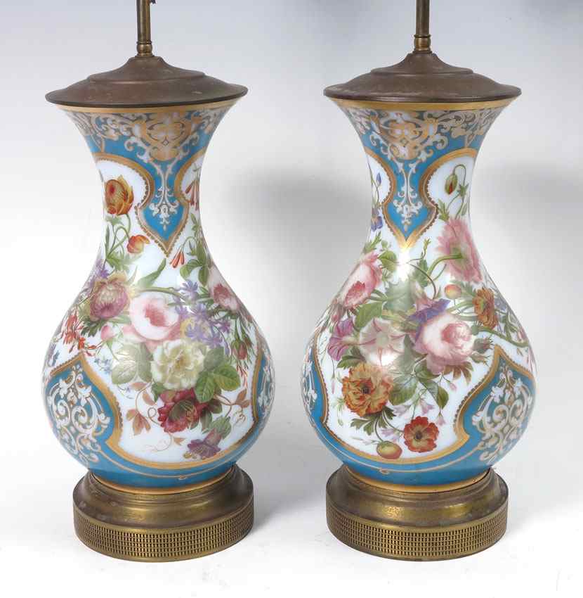 Appraisal: PAIR PAINT DECORATED OPAQUE GLASS LAMPS The style reminiscent of