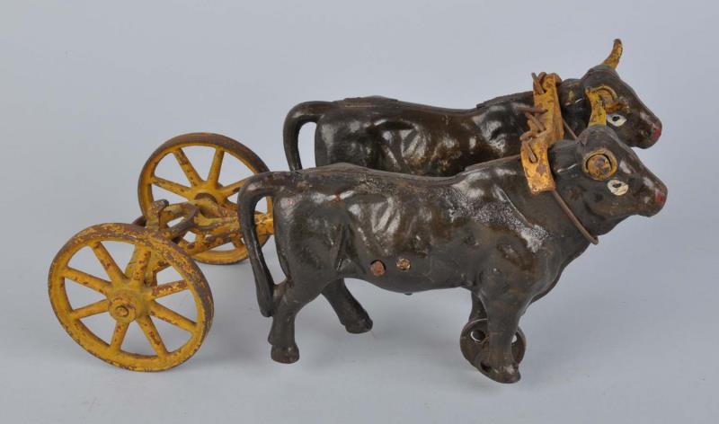 Appraisal: Cast Iron Kenton Ox Cart Team Includes two ox and