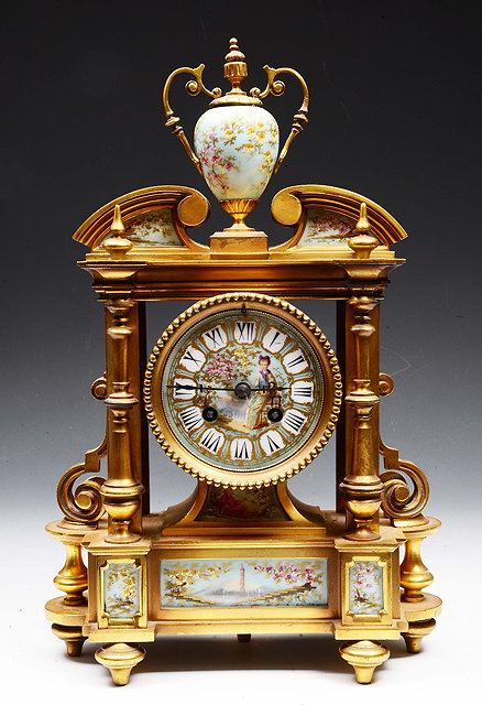 Appraisal: A FRENCH ORMOLU AND PORCELAIN MANTEL CLOCK with striking mechanism