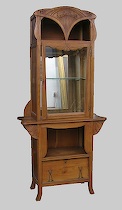 Appraisal: Tall Art Nouveau Display Cabinet Light walnut carved case in