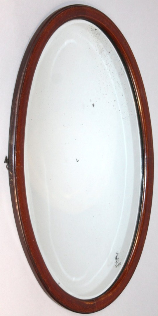 Appraisal: An Edwardian mahogany box wood and part inlaid mirror with