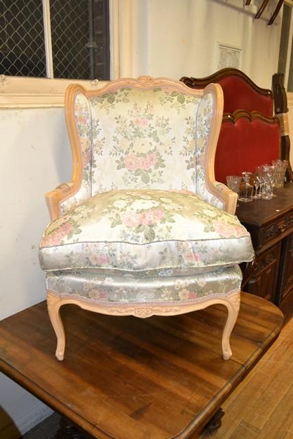 Appraisal: A BERGERE IN FLORAL UPHOLSTERY A BERGERE IN FLORAL UPHOLSTERY