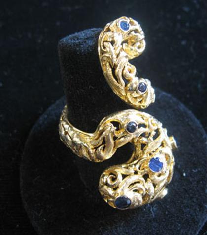 Appraisal: karat yellow gold and sapphire ring Ilias LaLaounis Contemporary curved