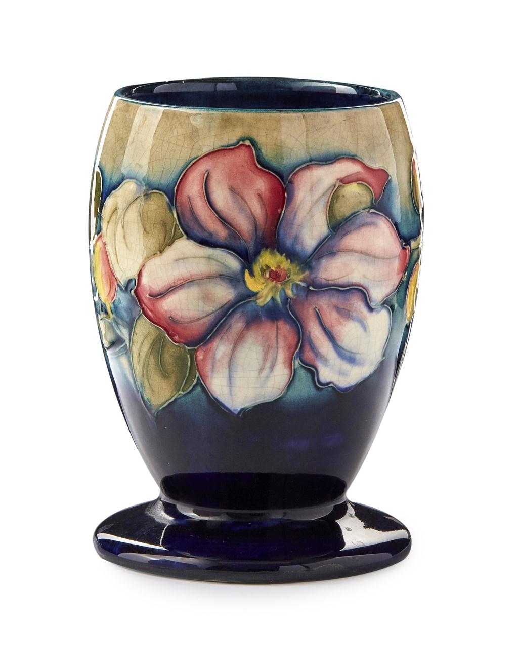 Appraisal: MOORCROFT POTTERY 'CLEMATIS' PATTERN FOOTED VASE S impressed facsimile signature