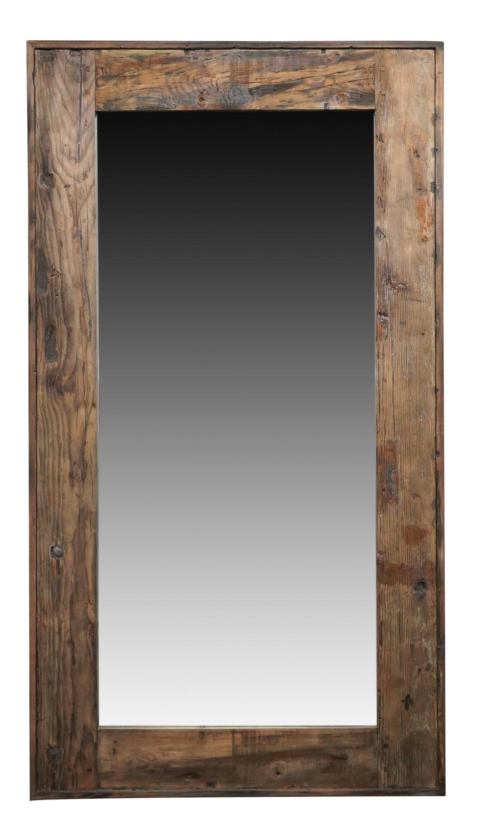 Appraisal: LARGE CONTEMPORARY WOODEN WALL MIRRORthe flat mirror plate surrounded by