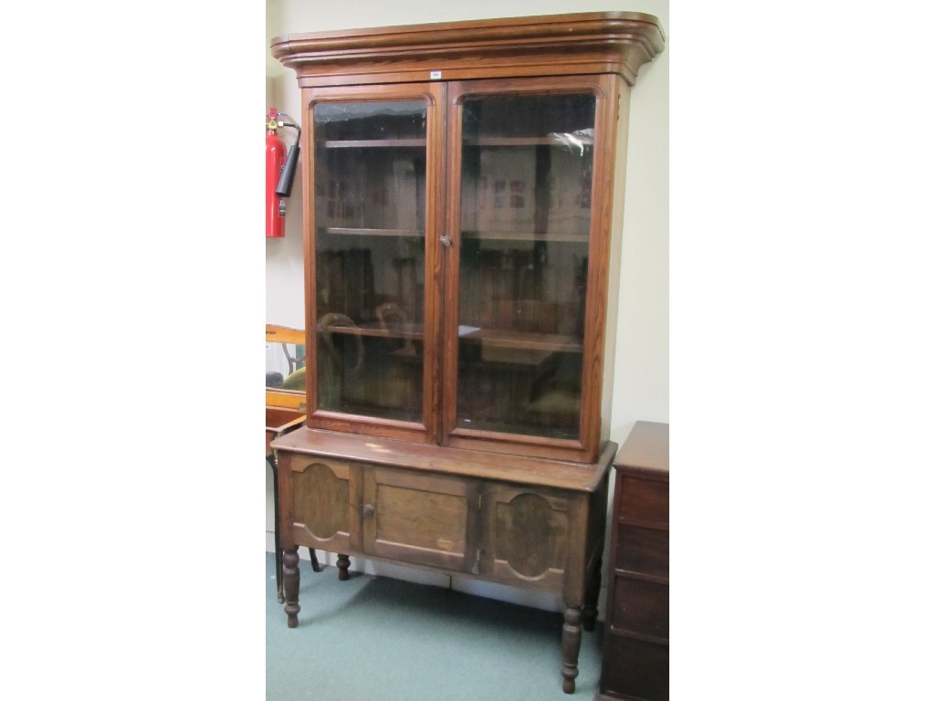 Appraisal: Victorian pitch pine bookcase on cupboard base