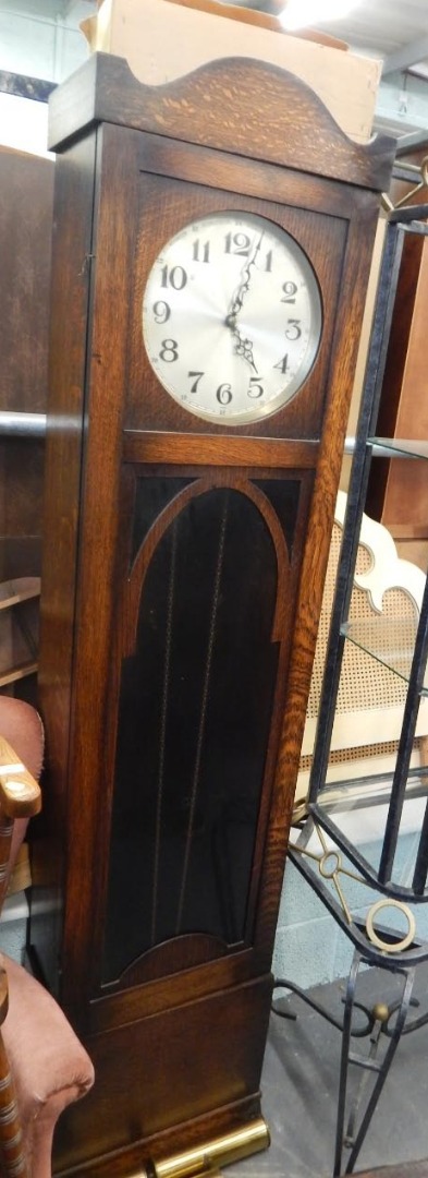 Appraisal: An oak longcase clock the silvered dial stamped foreign above