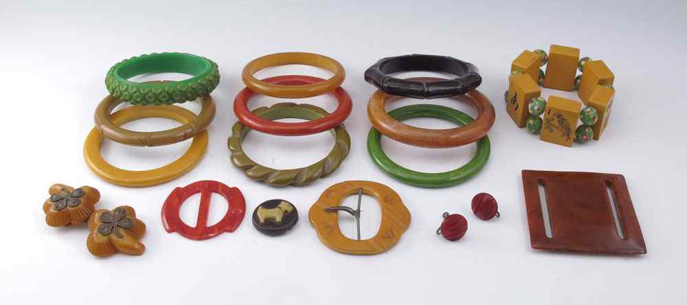 Appraisal: BAKELITE BRACELETS PLUS Good sample of green butterscotch black carved