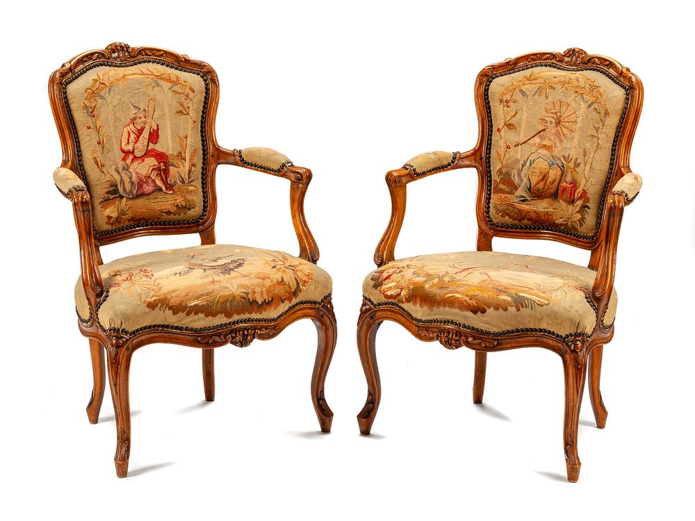 Appraisal: A Pair of Louis XV Tapestry-Upholstered Walnut Fauteuils A Pair