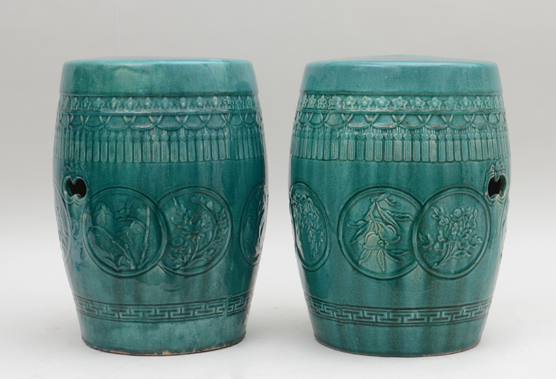 Appraisal: PAIR OF CHINESE TURQUOISE-GLAZED POTTERY BARREL-FORM GARDEN SEATS Each pierced