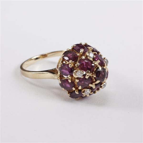 Appraisal: Yellow gold k amethyst and diamond cluster dome ring dwt