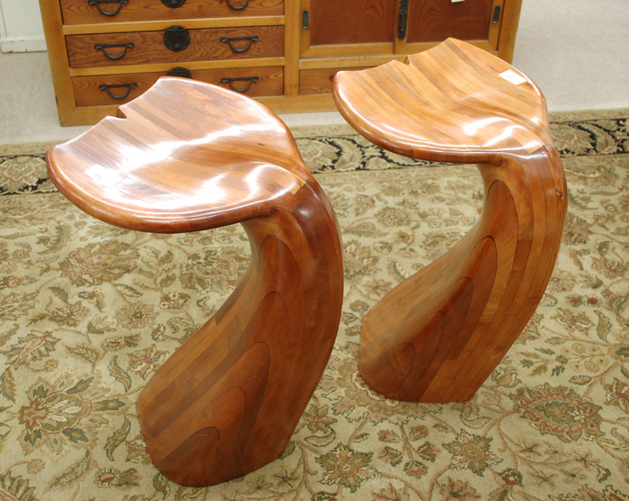 Appraisal: PAIR OF WOOD WHALE TAIL BAR STOOLS by artist Kristin