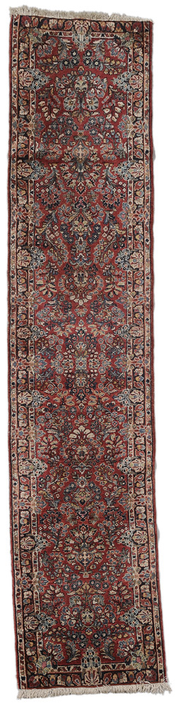 Appraisal: Sarouk Runner Persian s multiple floral bouquets on brick-red ground