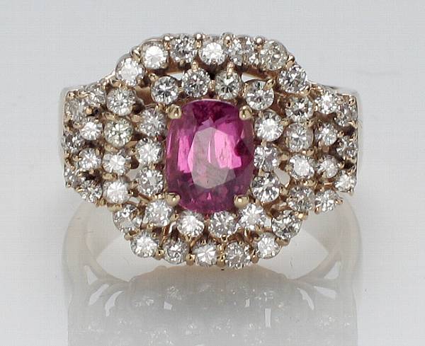 Appraisal: A pink sapphire and diamond ring estimated total diamond weight