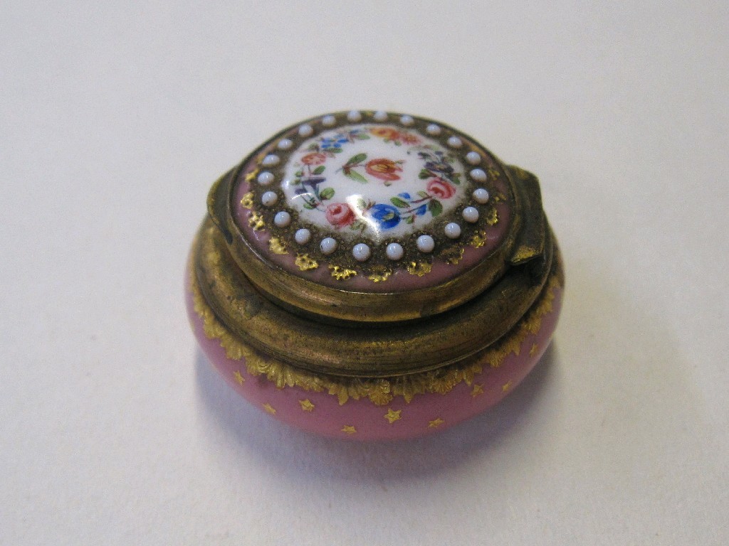 Appraisal: French enamel pill box of circular form the pink ground