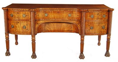 Appraisal: A Regency mahogany sideboard with a concave front and stringing