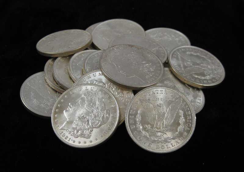 Appraisal: A ROLL OF TWENTY U S SILVER MORGAN DOLLARS all