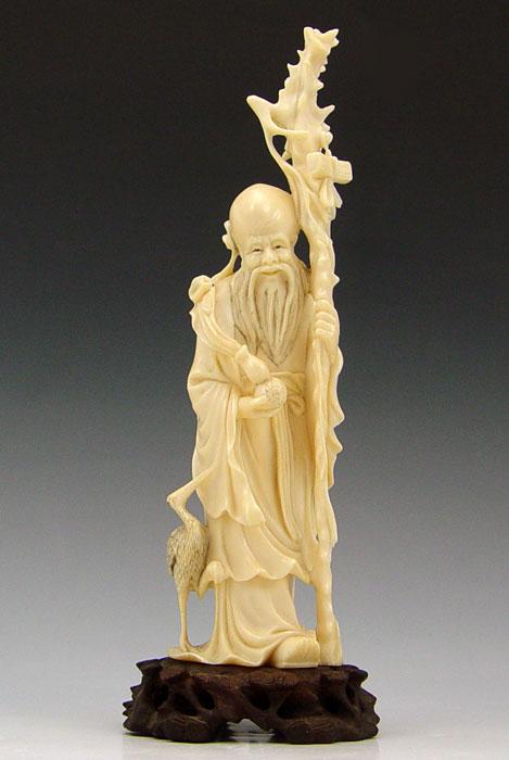 Appraisal: ASIAN CARVED IVORY ELDERLY MAN WITH STAFF Carving features elderly