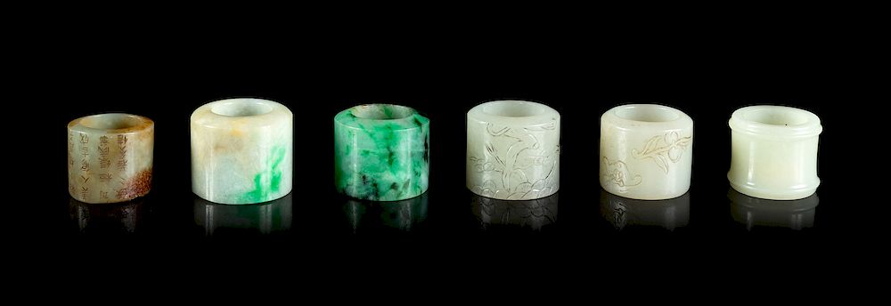 Appraisal: Six Jade and Jadeite Archer's Rings Largest overall diam in