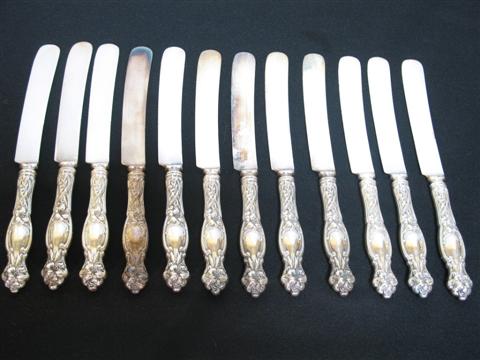 Appraisal: SET OF TWELVE DINNER KNIVES Decorated in the art nouveau