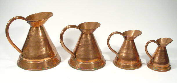 Appraisal: Graduated set of four Victorian hammered copper jugs largest cm