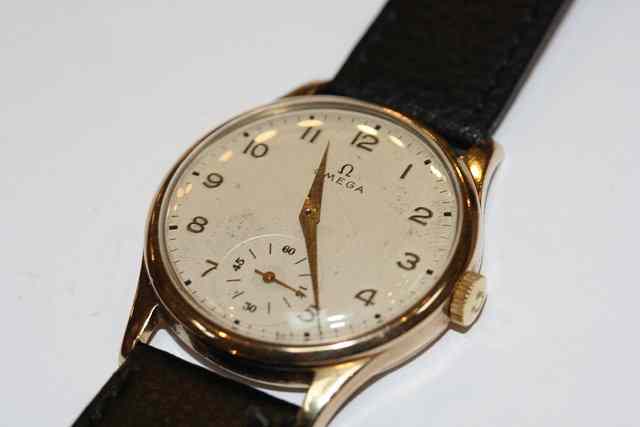 Appraisal: A 'S CT GOLD CASED OMEGA WRIST WATCH the dial