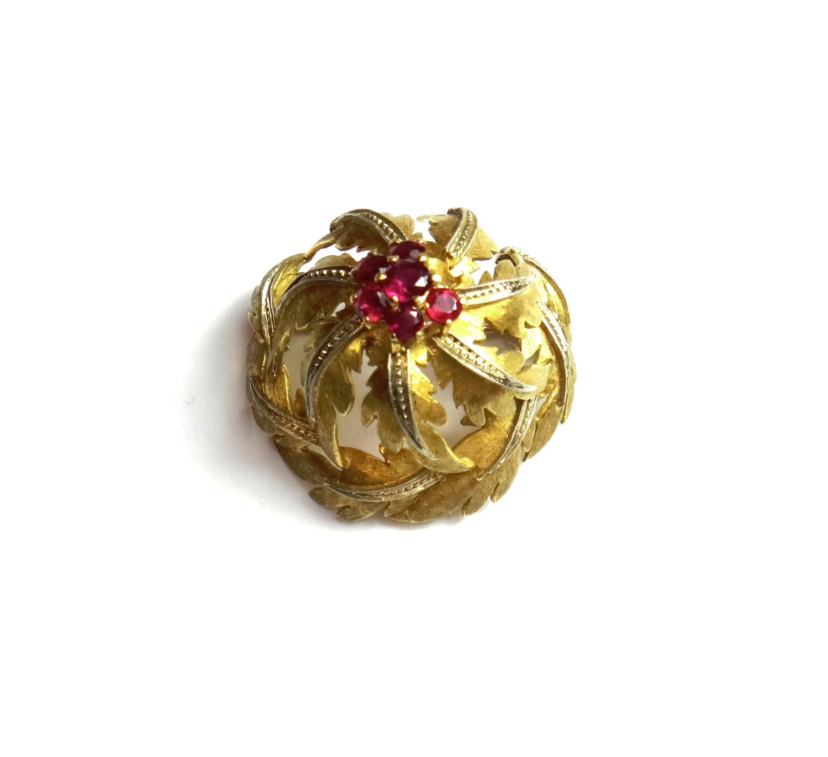 Appraisal: An ct gold and ruby set brooch in a foliate