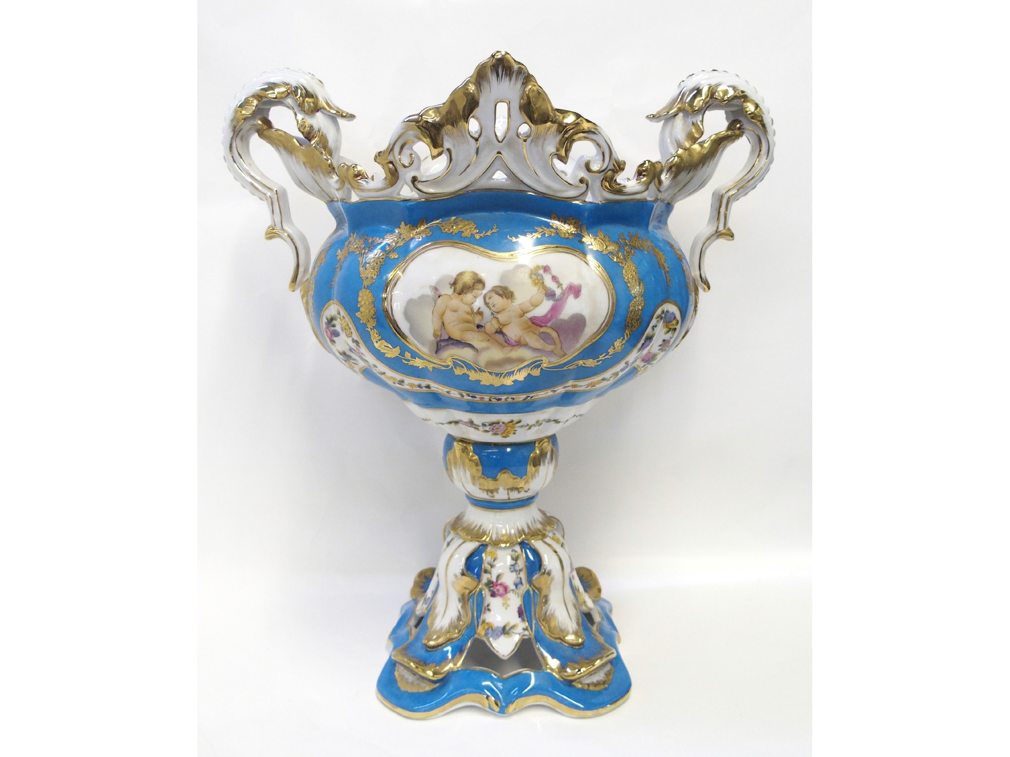 Appraisal: Porcelain twin handled urn decorated with cherubs and gilded swag