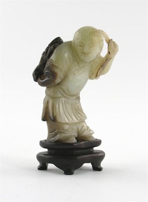 Appraisal: A Chinese jade carving of a boy carrying a string