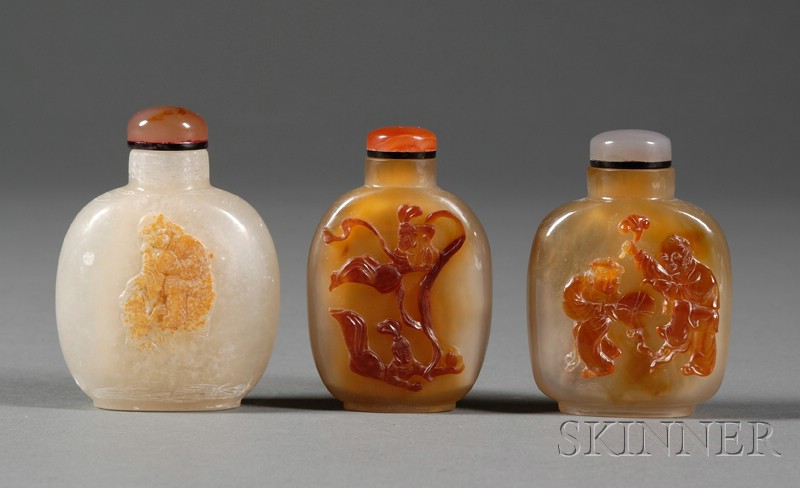 Appraisal: Three Shadow Agate Snuff Bottles carving of an Immortal on