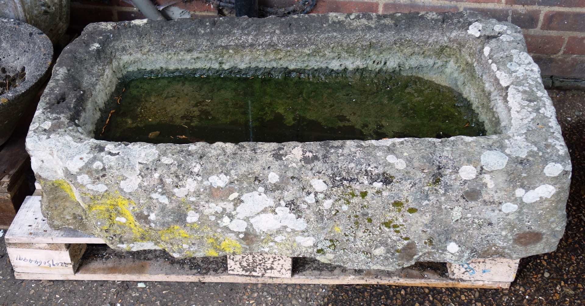 Appraisal: A rectangular carved stone trough circa th century cm wide