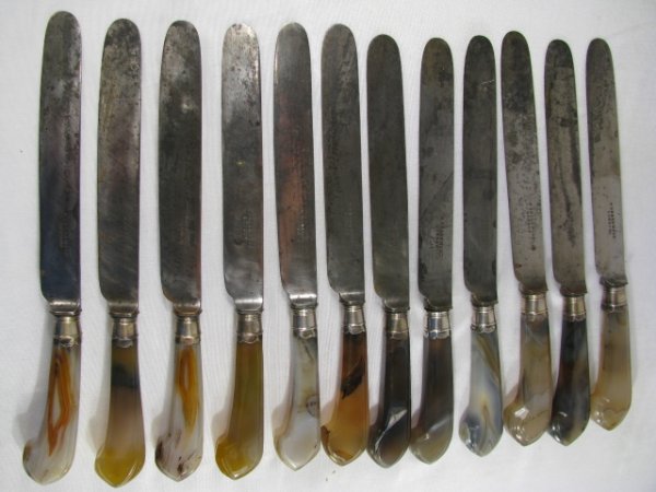 Appraisal: Twelve th th century agate stone handle knives blades stamped