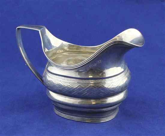 Appraisal: A George III Irish silver cream jug of rounded rectangular