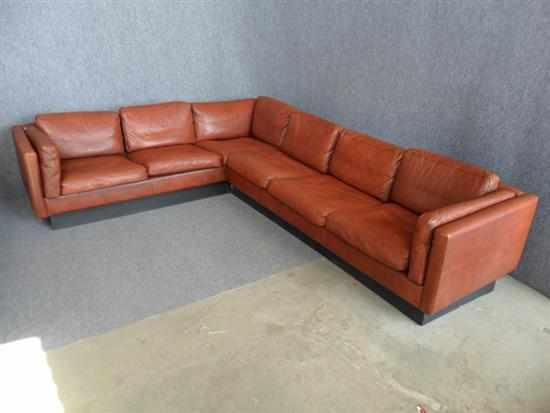 Appraisal: A DANISH BURNT ORANGE LEATHER CORNER SOFA