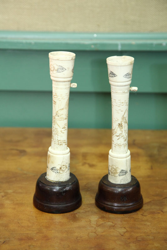 Appraisal: PAIR OF IVORY CANDLESTICKS Oriental style sticks with incised decoration