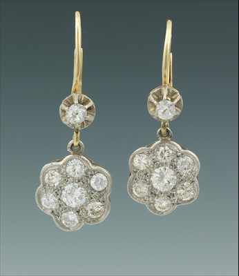 Appraisal: A Pair of Platinum and Diamond Cluster Earrings Platinum florette