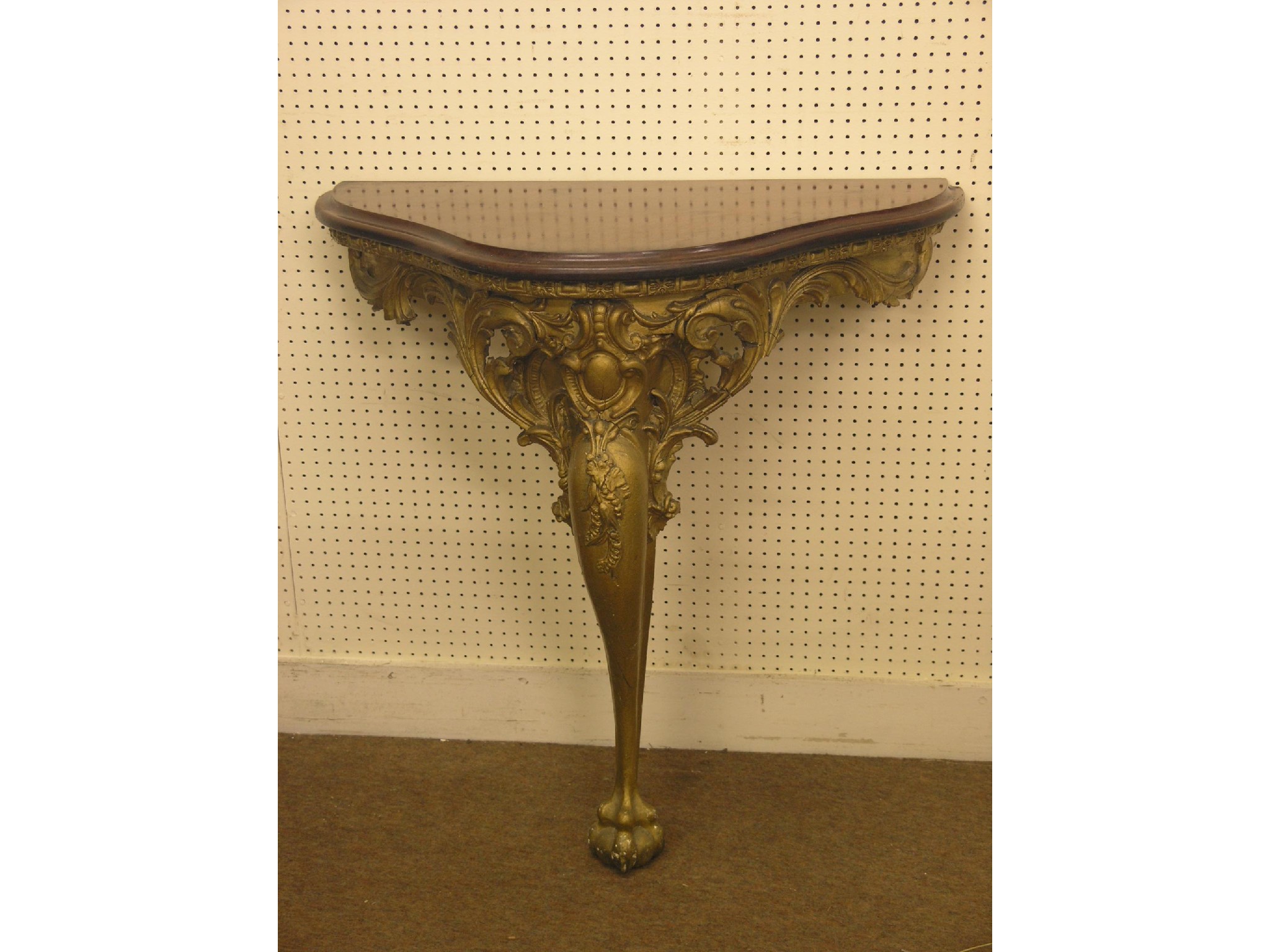 Appraisal: A Louis XV-style moulded gilt console table serpentine-shape with solid