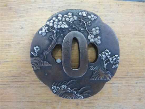 Appraisal: CAST BRONZE SILVER OVERLAID TSUBA SIGNED