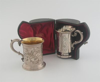 Appraisal: A Victorian waisted mug with engraved decoration and scrolling handle