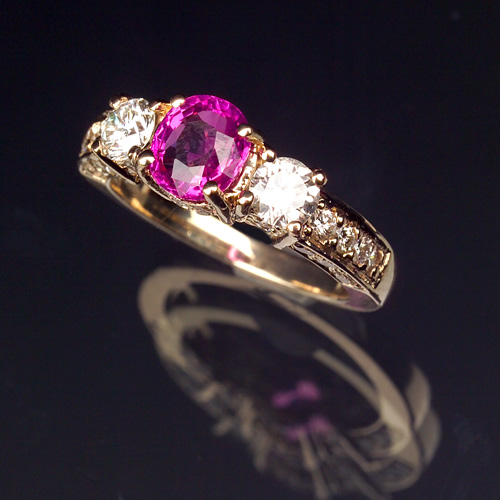 Appraisal: PINK SAPPHIRE AND DIAMOND Ring in k yellow gold Oval