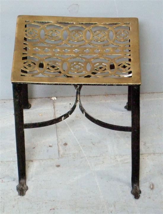 Appraisal: th century brass and cast-iron kettle stand with pierced decoration