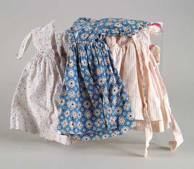 Appraisal: LOT OF ANTIQUE DOLL CLOTHING Seven cotton print dresses for