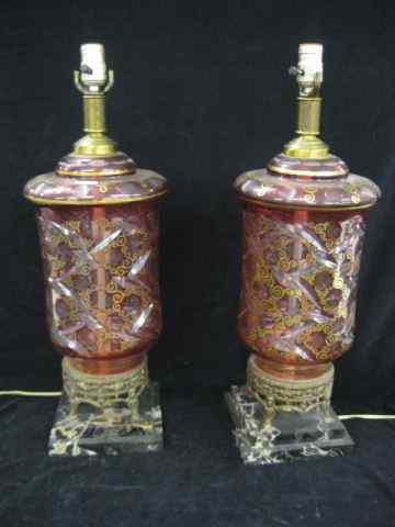 Appraisal: Pair of Cranberry Cut-to-Clear Lamps beautiful design with gold trim