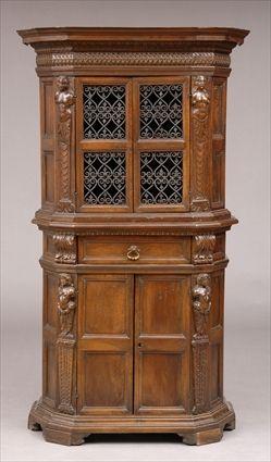 Appraisal: ITALIAN BAROQUE-SYLE CAST-IRON MOUNTED WALNUT TWO-PART CABINET The shaped cornice