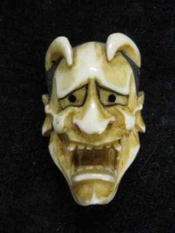 Appraisal: Carved Ivory Netsuke of a Devil Mask signed '' excellent