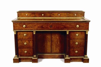 Appraisal: An Empire rosewood and ormolu mounted desk with a cartonnier